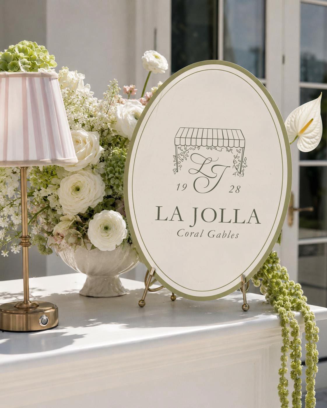 La Jolla plaque among white flowers.