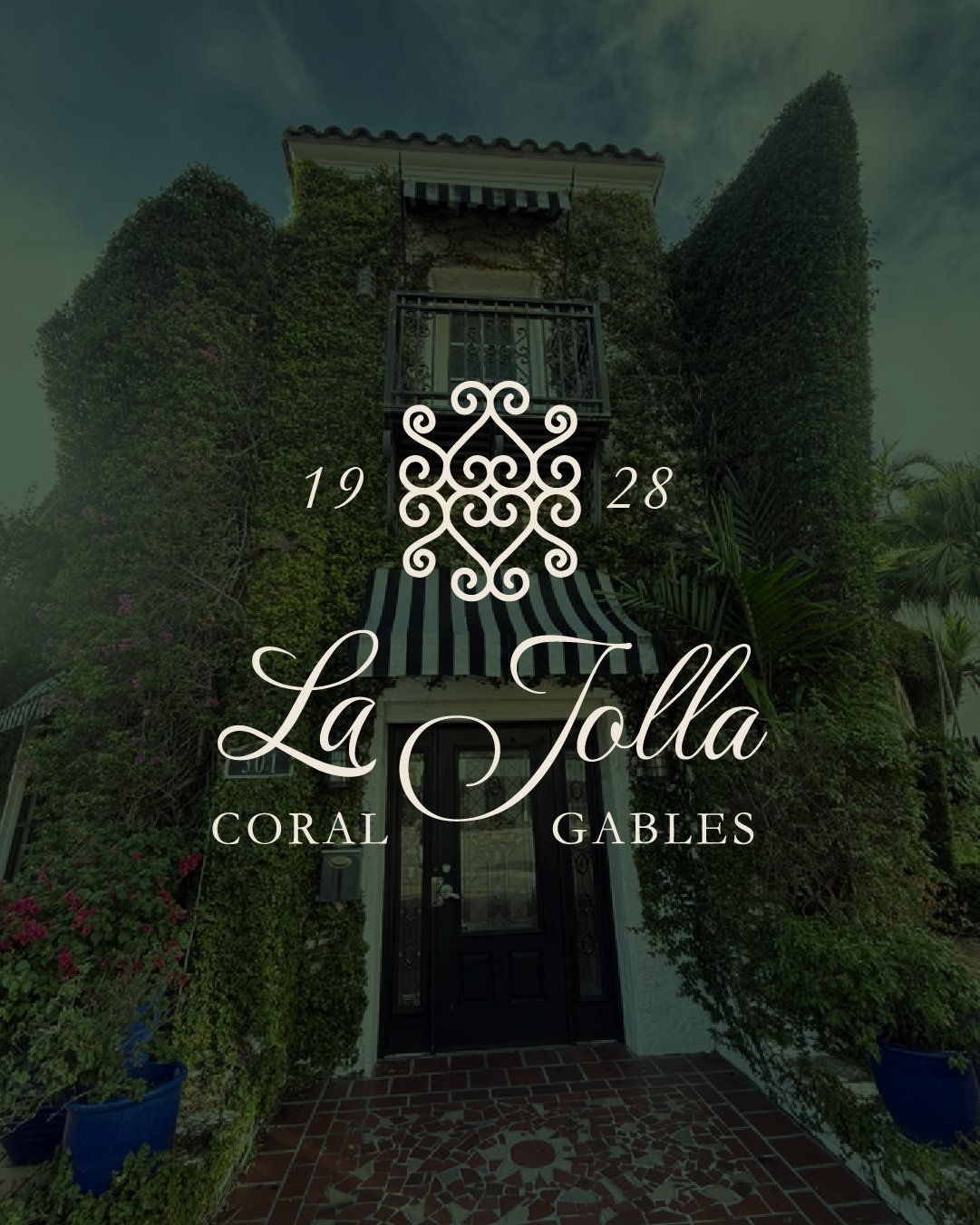 La Jolla at 301 Alcazar Avenue, Coral Gables — ivy façade with striped awnings.